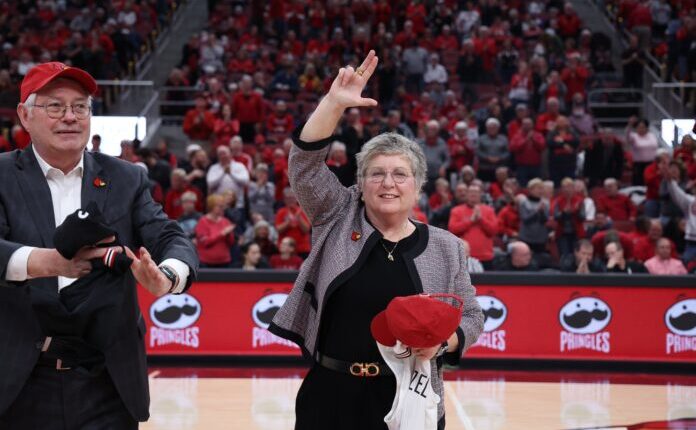 Kim Schatzel and husband Trevor Iles are introduced at KFC Yum! Center during a Louisville Cardinals women's basketball game.